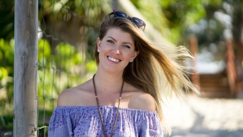 Headshot of beach girl with hair flowing in wind