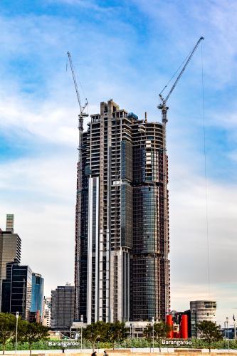 International Tower Skyscraper with Cranes