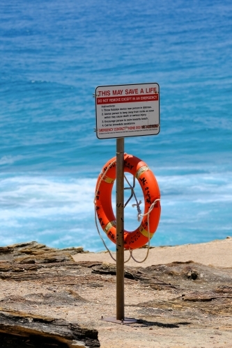 Life buoy and warning sign on cliff at North Gorge,  Stradbroke