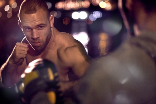 Men in urban city boxing fitness training