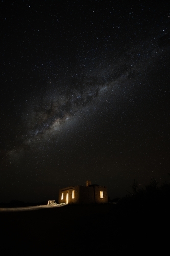 milky way over old stone building