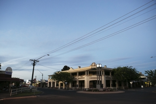 Old building on street corner with roundabout in foreground in regional town