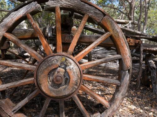 Old partly broken wagon wheel