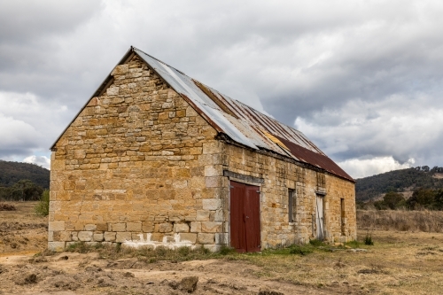 Old stone brick building in a field