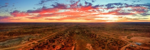 Panorama looking over plains in the outback at sunset