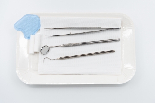 Professional dental instruments on white background