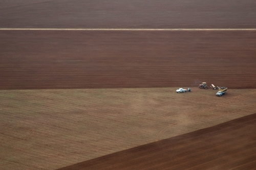 Rural Outback Aerial Landscape with Trucks and Farm Machinery