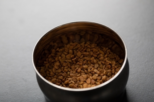 Spice tin of fenugreek seeds