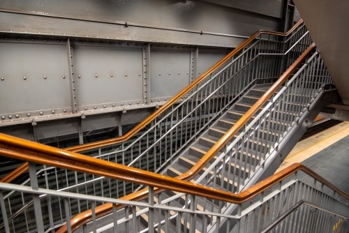 Stairs with wooden handrails in the underground train system in Sydney