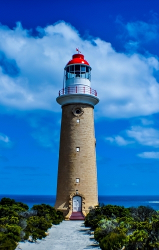 Stone lighthouse with red top