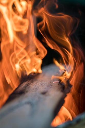 Timber plank on fire with shallow depth of field