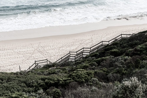 timber stairs leading to beach in the seascape