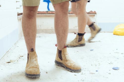 Tradesman wearing boots on construction site