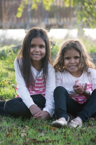 Two happy Aboriginal girl sisters