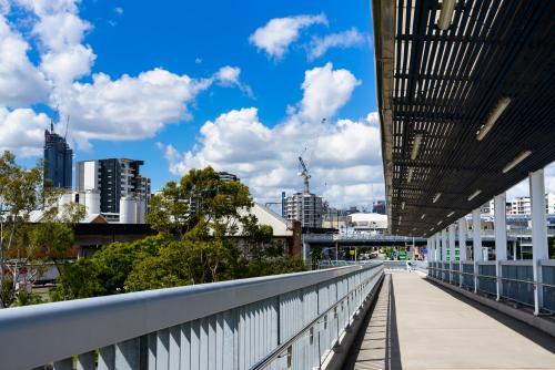 View from the pedestrian and bikeway on the Go Between Bridge with pedestrian in distance