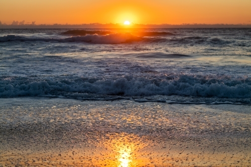 waves and beach at sunrise