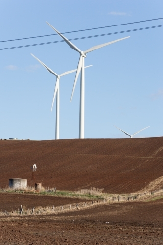 Wind turbines in tilled paddock