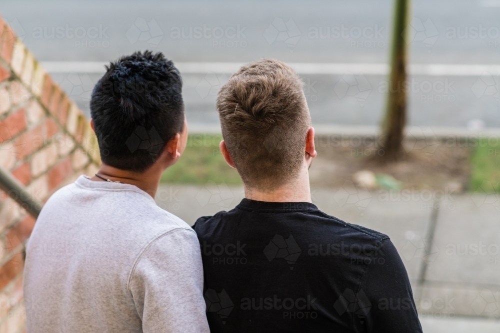 2 gay men, anonymous view from behind - Australian Stock Image