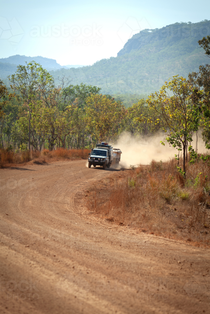 4 x 4 driving on dusty gravel road - Australian Stock Image