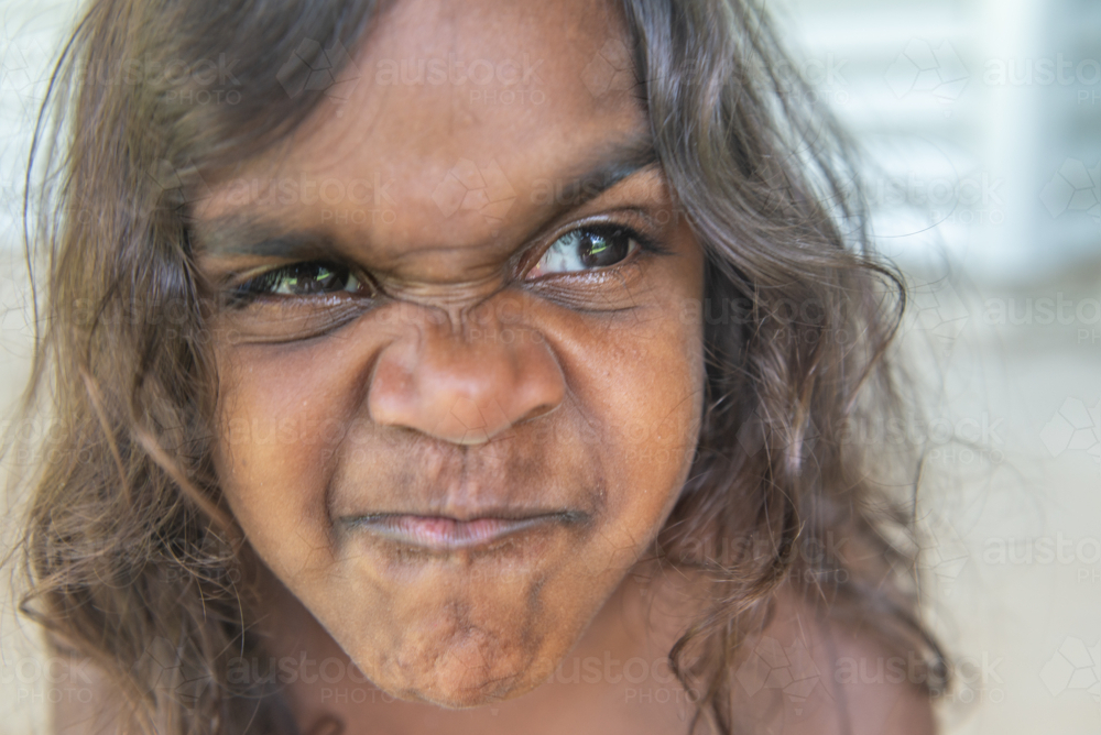 4 year old aboriginal girl with scrunched up face - Australian Stock Image