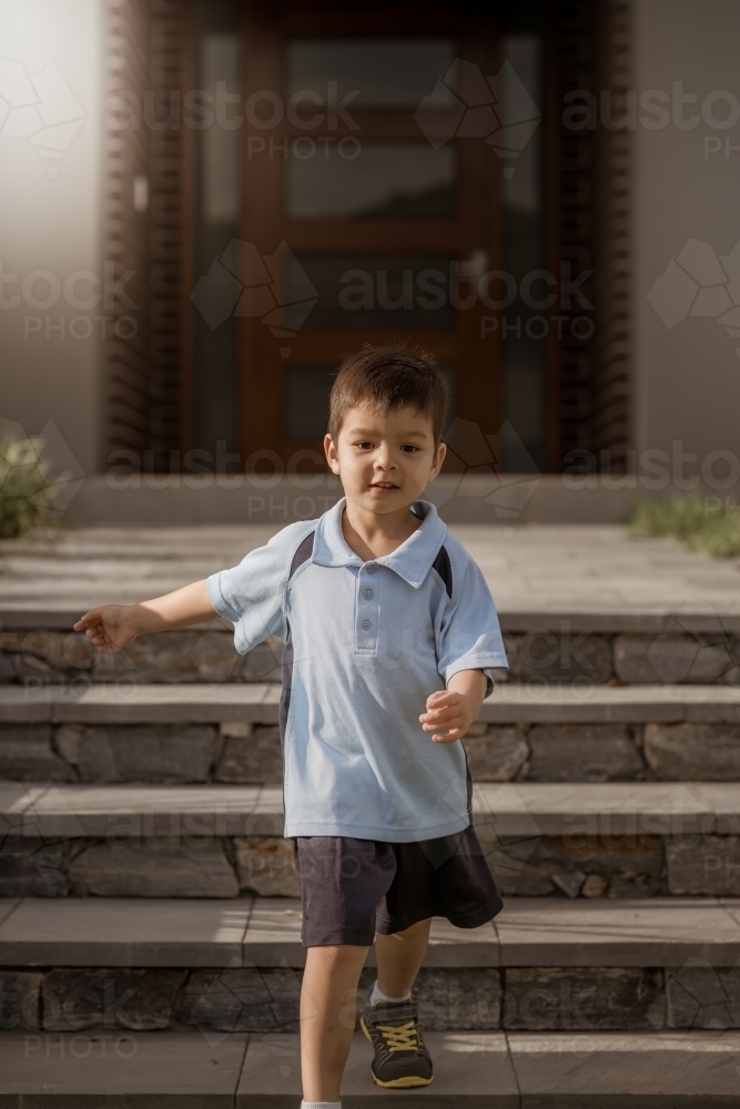 4 year old mixed race boy leaves home for his first day of preschool - Australian Stock Image