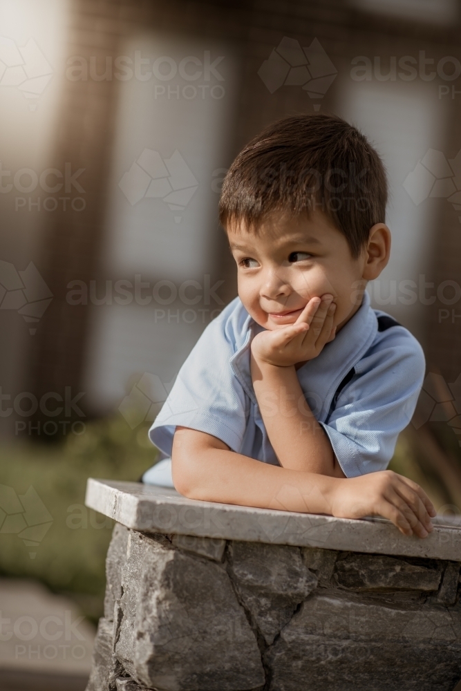 4 year old mixed race boy leaves home for his first day of preschool - Australian Stock Image
