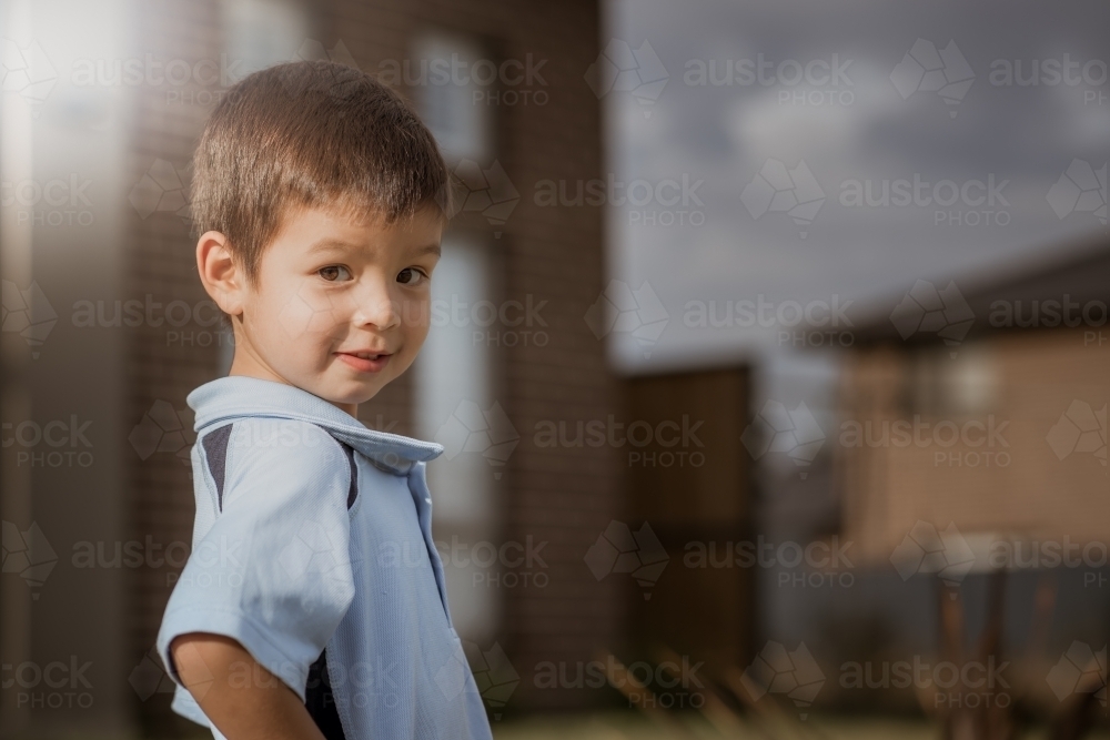 4 year old mixed race boy leaves home for his first day of preschool - Australian Stock Image