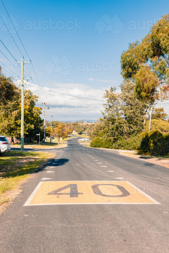 40 kmh speed limit painted on road in regional Australian town's school zone - Australian Stock Image