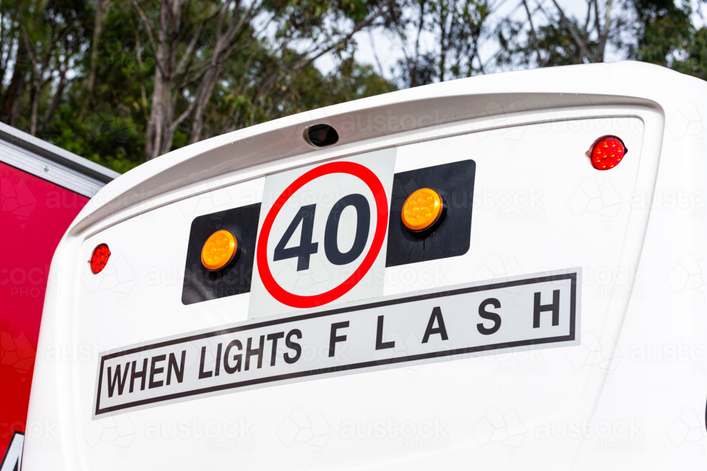 40 when lights flash sign on back of bus - Australian Stock Image