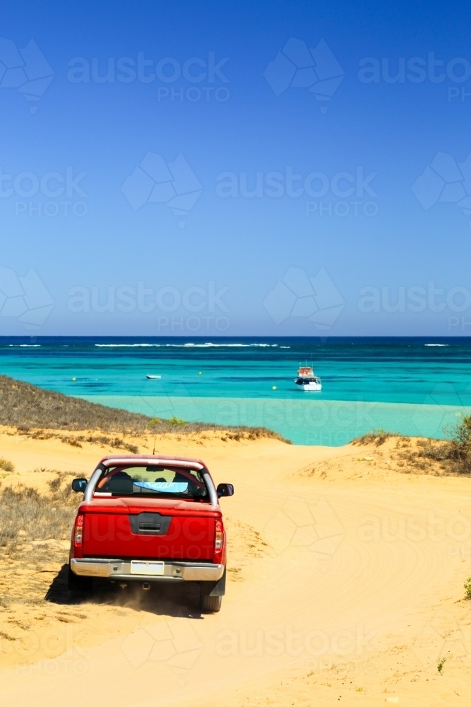4WD arrives at the ocean and Ningaloo Reef in Coral Bay - Australian Stock Image