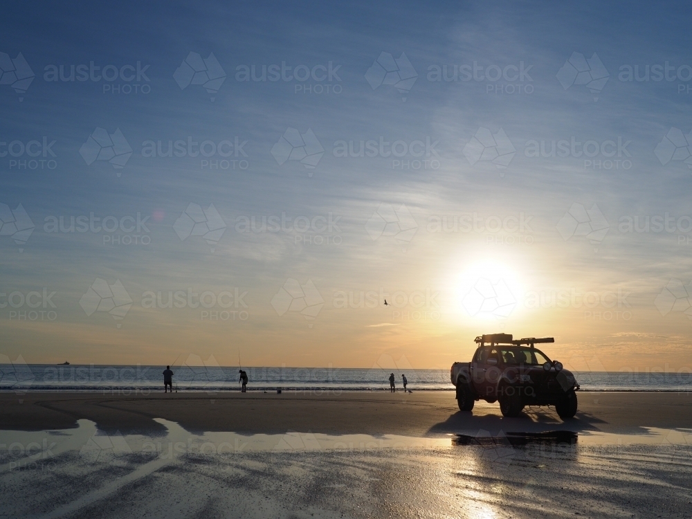 4WD on Cable Beach at Sunset - Australian Stock Image