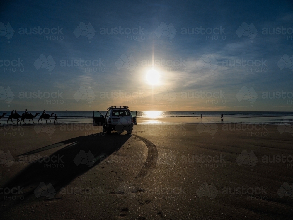 4WD on Cable Beach with Camels About to Walk By - Australian Stock Image