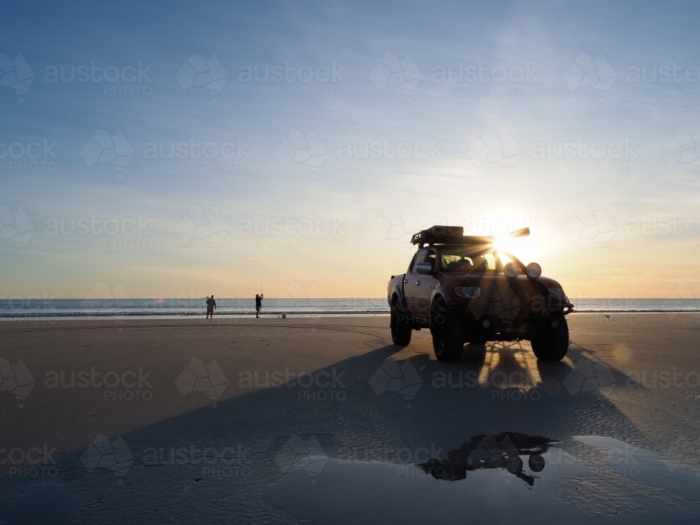 4WD Parked on Cable Beach with Two Men Fishing - Australian Stock Image