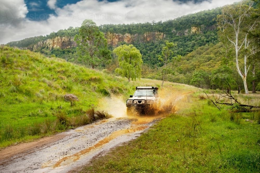 4x4 driving through a muddy track - Australian Stock Image