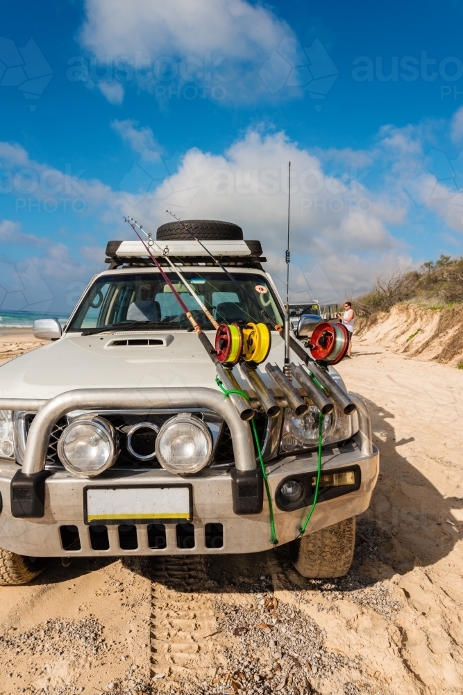 4x4 on the beach, with fishing rods - Australian Stock Image
