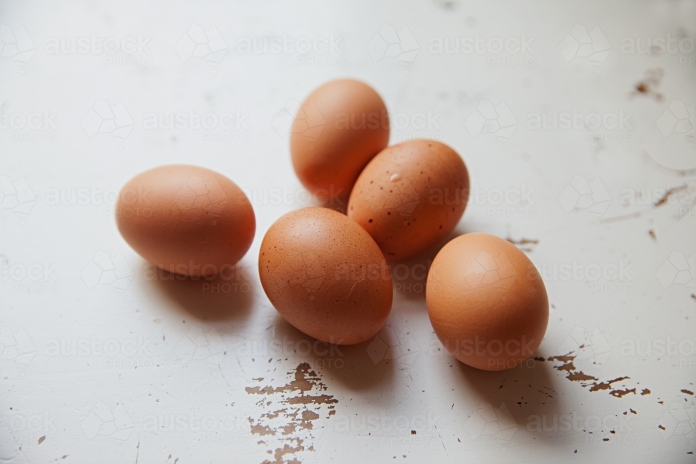 5 eggs on a white tabletop - Australian Stock Image