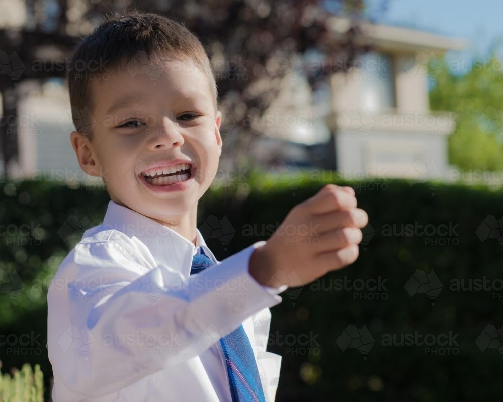 5 year old mixed race boy wearing his school uniform on his first day of school - Australian Stock Image
