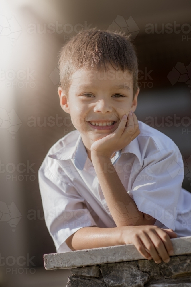 6 year old mixed race boy leaves home for his first day of school - Australian Stock Image