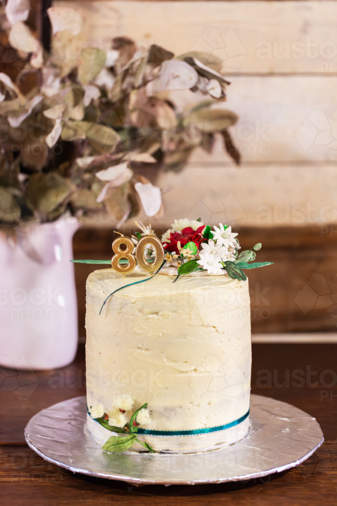 80th birthday cake with hand made australian native flowers - Australian Stock Image