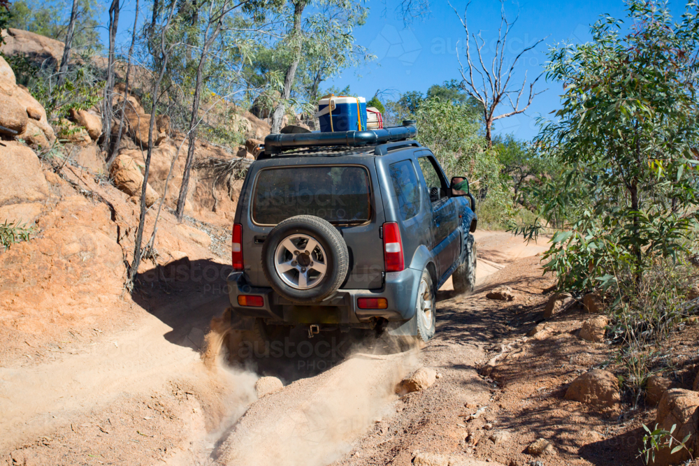 A 4WD car traveling a rural track in the outback near Mt Su - Australian Stock Image