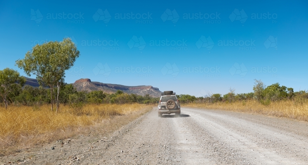 a 4WD vehicle on the gravel Gibb River Road in the Kimberley - Australian Stock Image