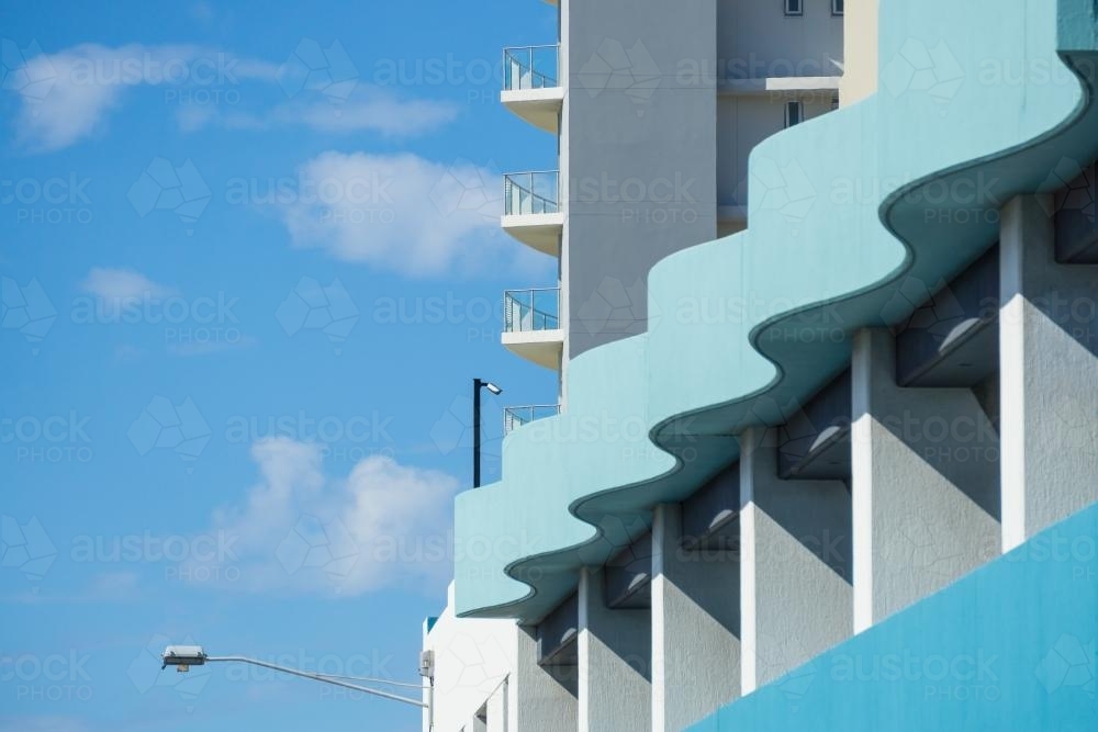 A blue wave like protrusion on the facade on a building - Australian Stock Image