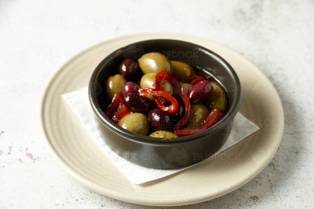 Image of A bowl of olives Austockphoto