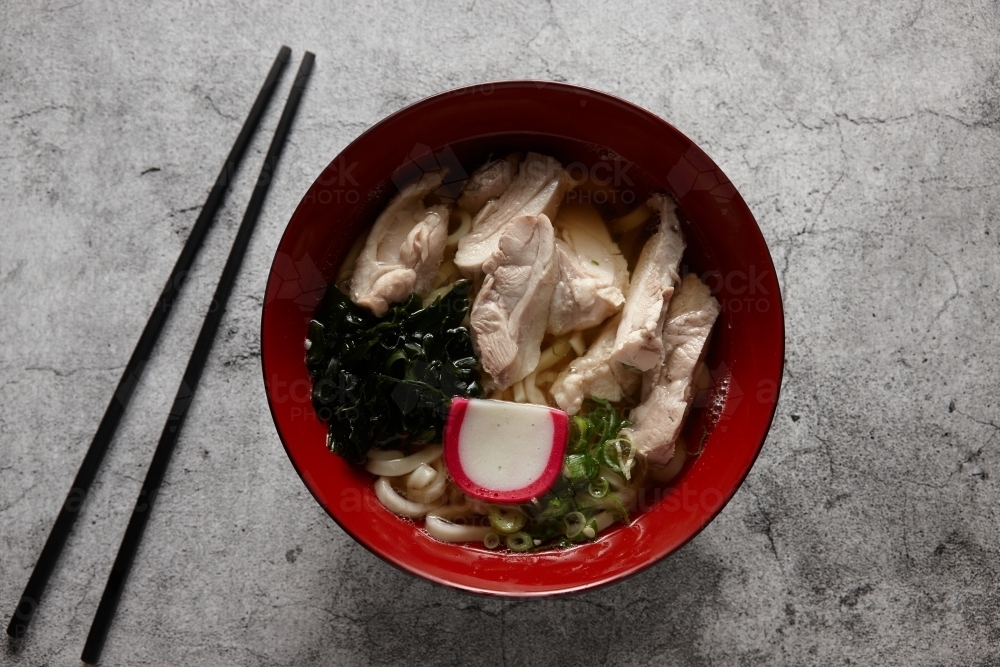 A bowl of ramen with chopsticks - Australian Stock Image
