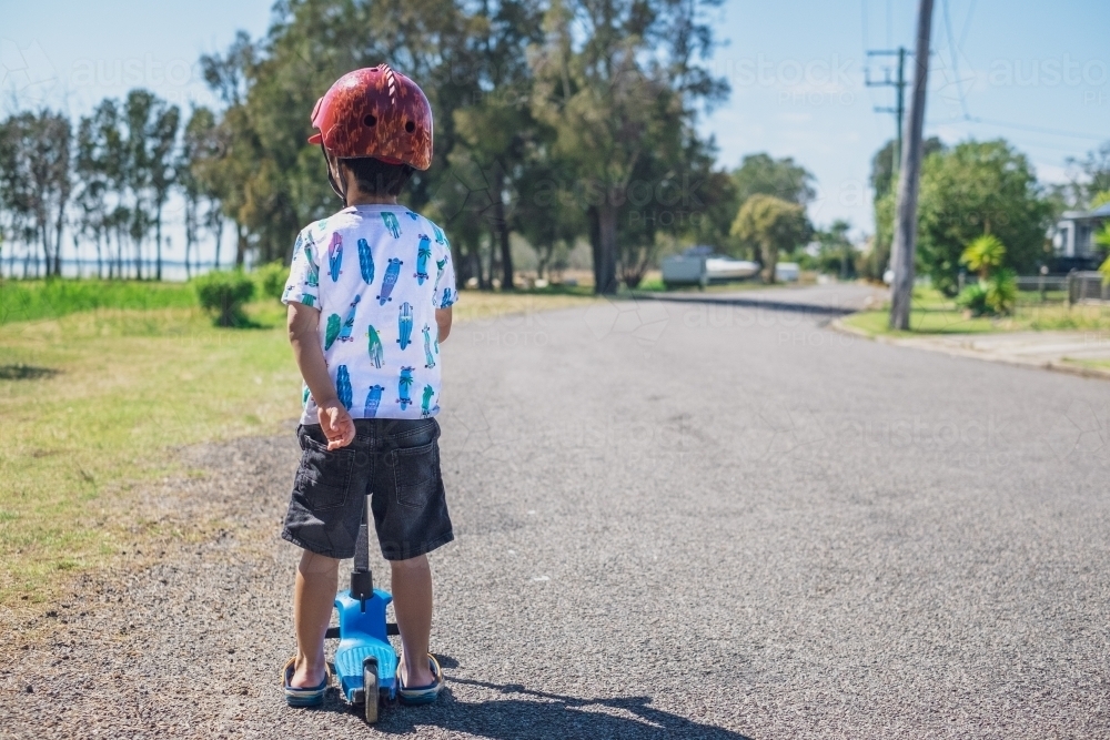 a boy with his scooter, exploring - Australian Stock Image