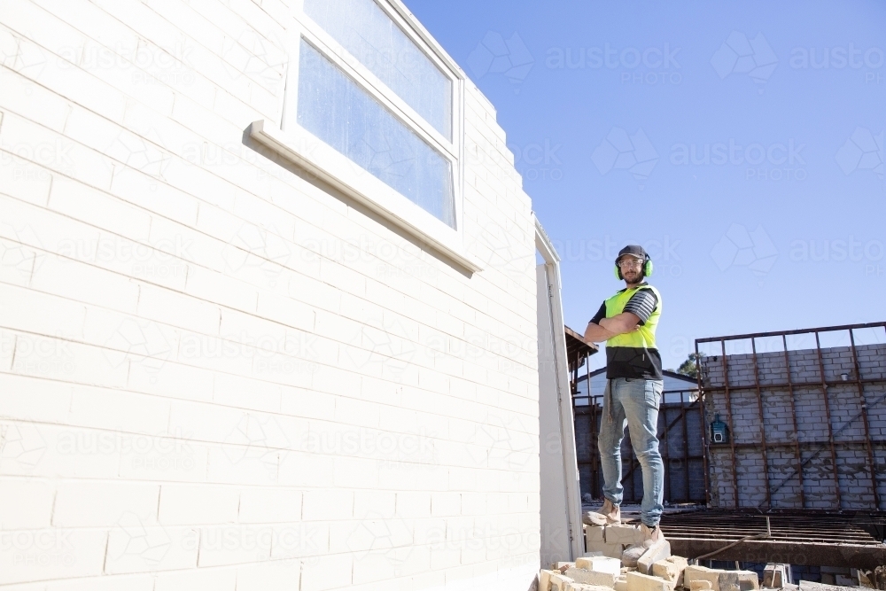 A builder working at height on on construction - Australian Stock Image