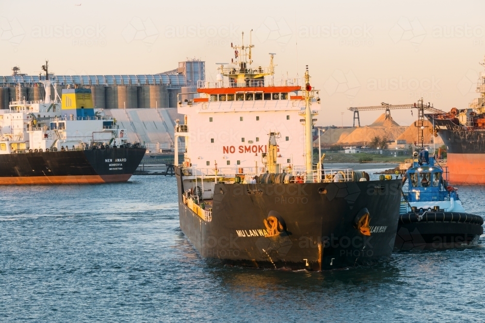 Image of A cargo ship anchored at the Port of Brisbane Austockphoto