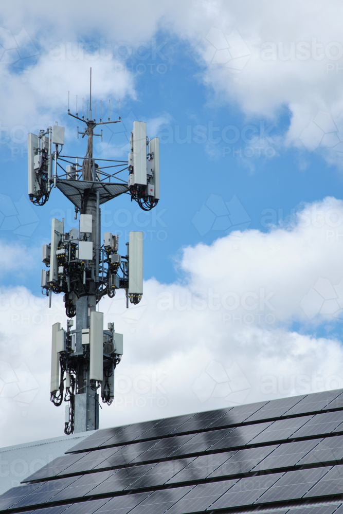 a cell tower with multiple antennas, transceivers, and other communication equipment. - Australian Stock Image