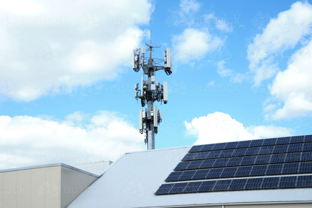 a cell tower with multiple antennas, transceivers, and other communication equipment. - Australian Stock Image