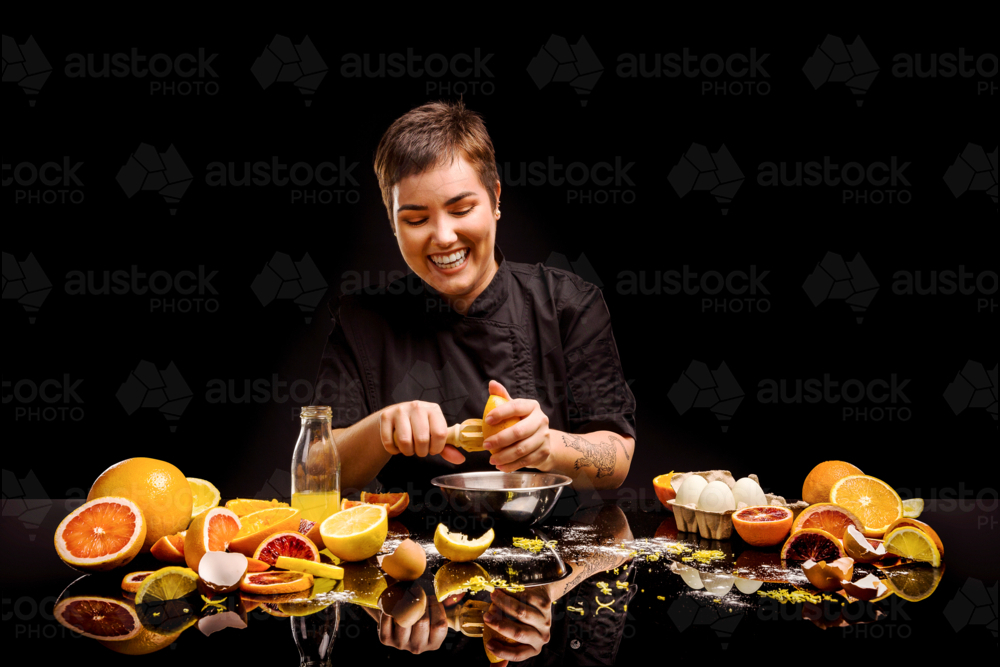 a chef making a citrus dessert - Australian Stock Image